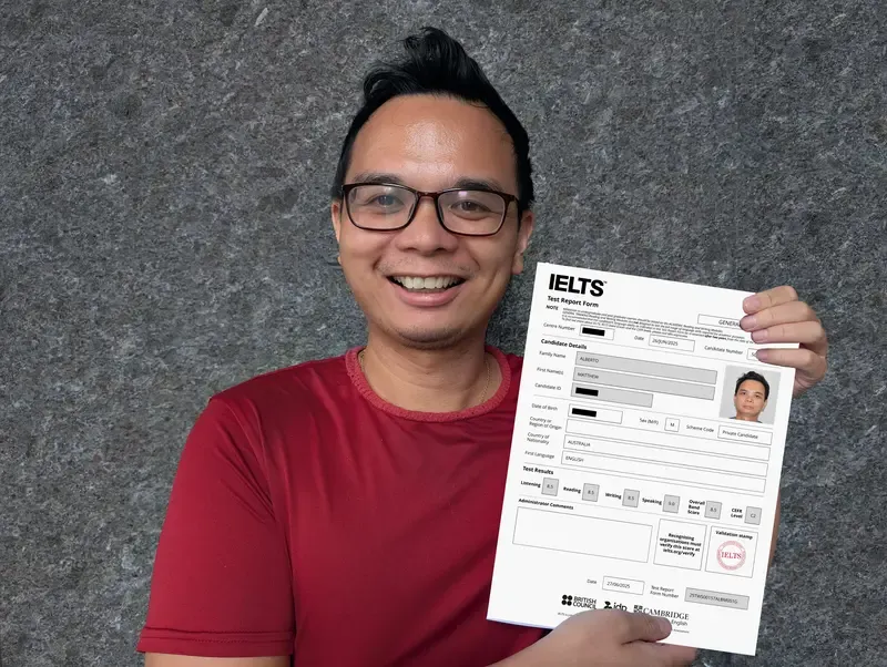 Matt, creator of SpeakPrac, holding his official IELTS Band 9 Certificate